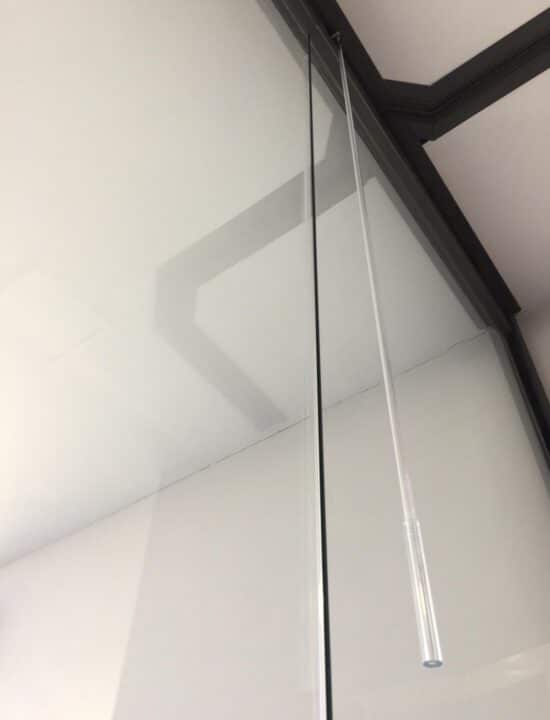 tirador cortina cristal